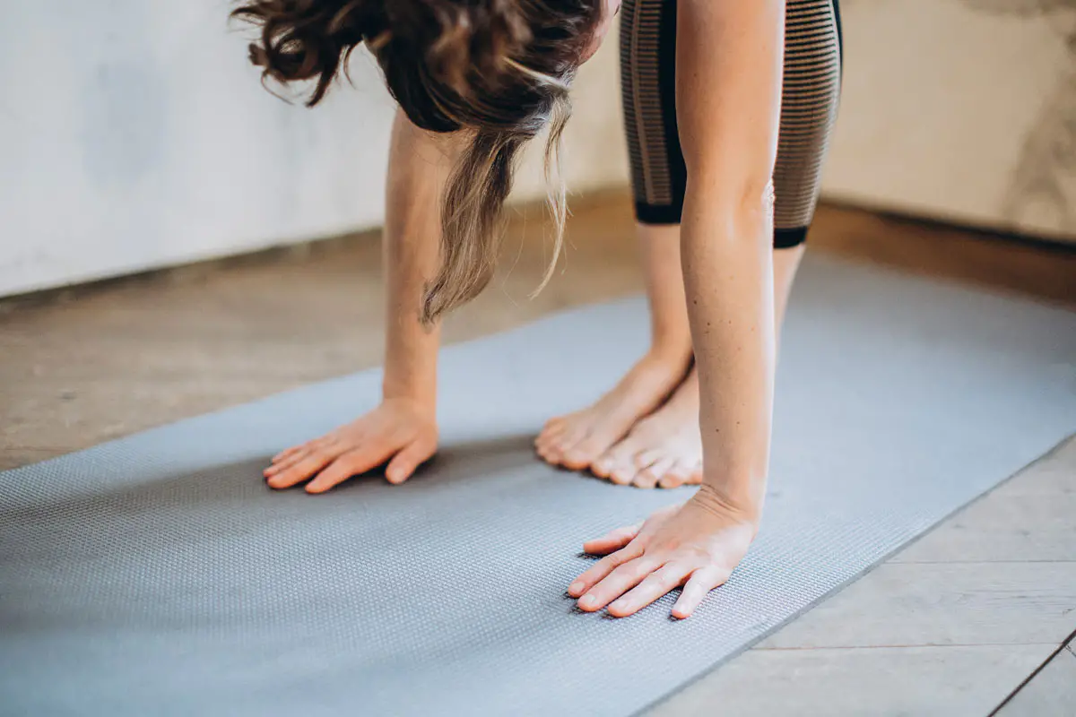 Woman bending in yoga class